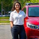 Farida A. with her sparkling SUV