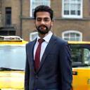 Rajiv M. in front of his taxi