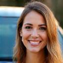 Sarah B. smiling next to her clean car